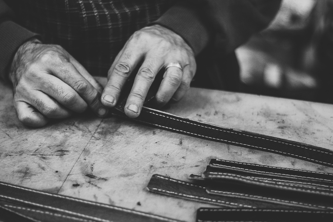 Skilled hands demonstrating a careful crafting technique with precision and dexterity